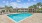 Pet Friendly Apartments in Germantown Nashville TN - The Monroe - Resort-Style Pool with Sun Deck, Lounge Chairs, and View of Building Exterior