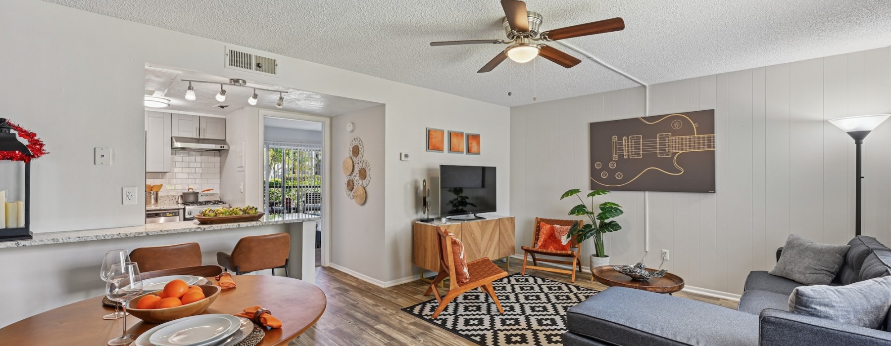 living room with furniture ceiling fan tv and tables